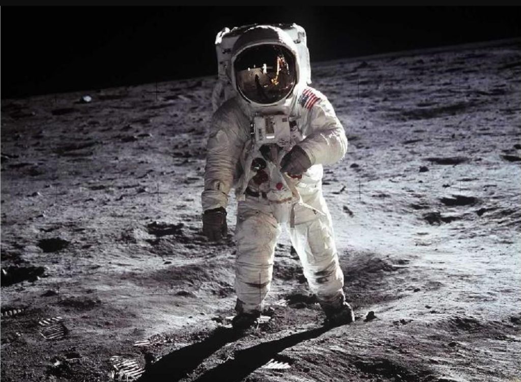 When you see this iconic image of Buzz Aldrin standing in the Sea of Tranquility on July 20, 1969, what narative, what story occurs to you? How does this one picture capture a 1000 stories?